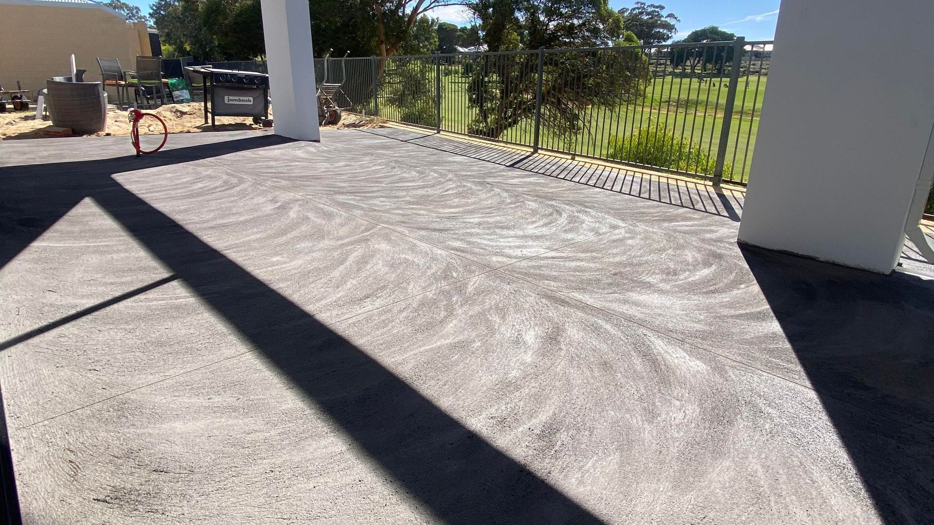 Charcoal Concrete Patio Area Over Looking Golf Course