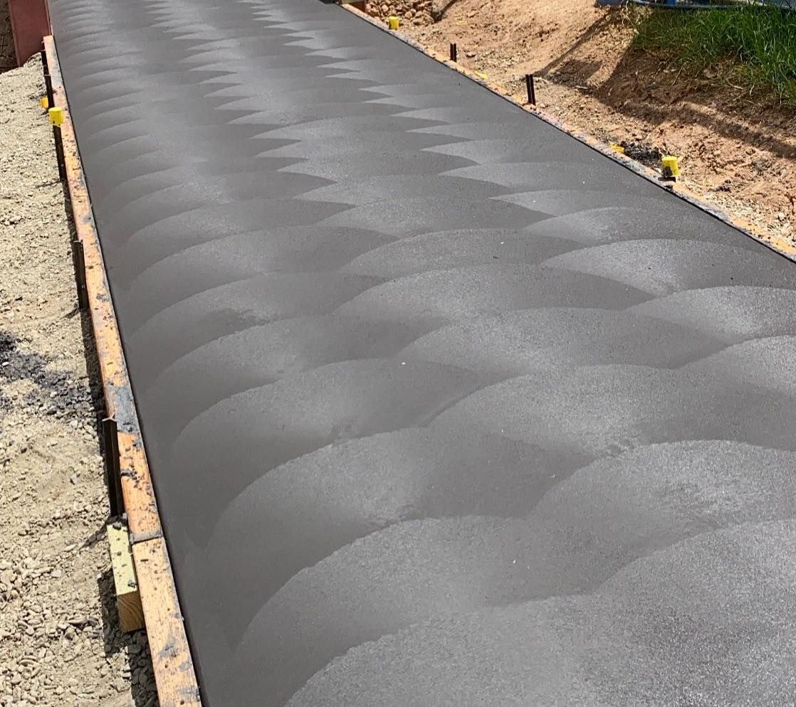 Charcoal Coloured Concrete Path in Backyard of Perth Property