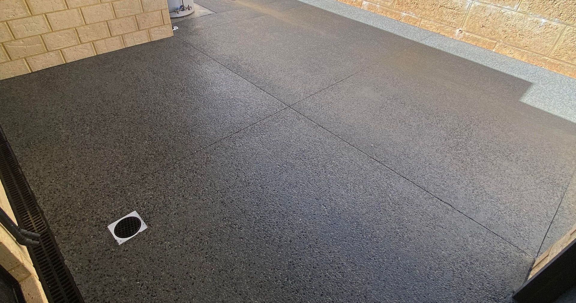 Patio in Perth Home featuring Charcoal Concrete with Exposed Aggregate Finish in