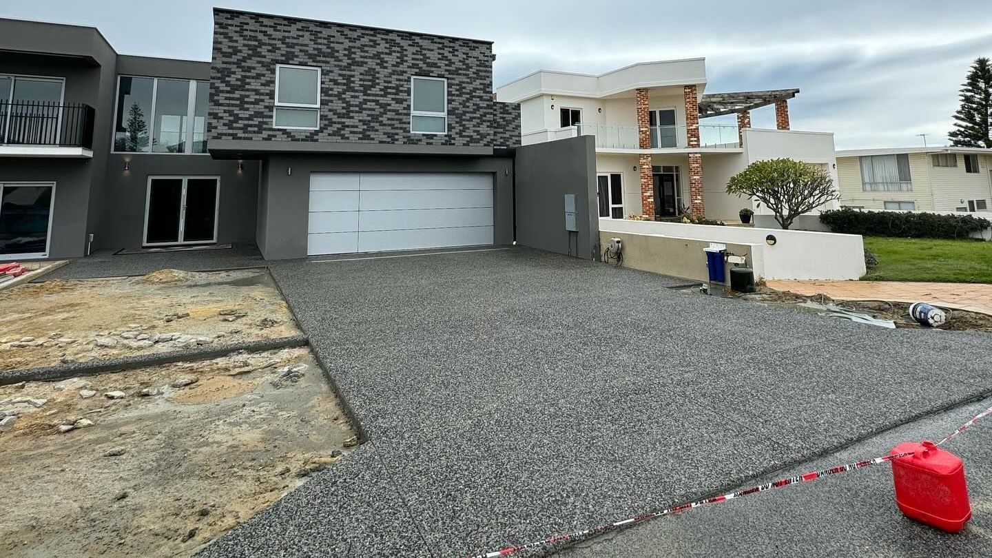 Charcoal exposed aggregate driveway for new two storey home in Perth