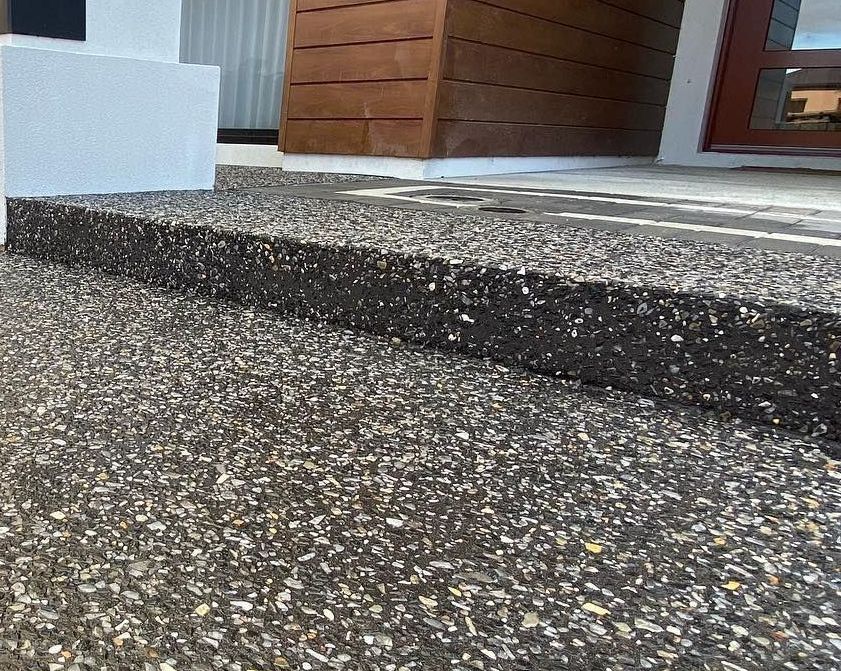 Charcoal exposed aggregate step and path to front door