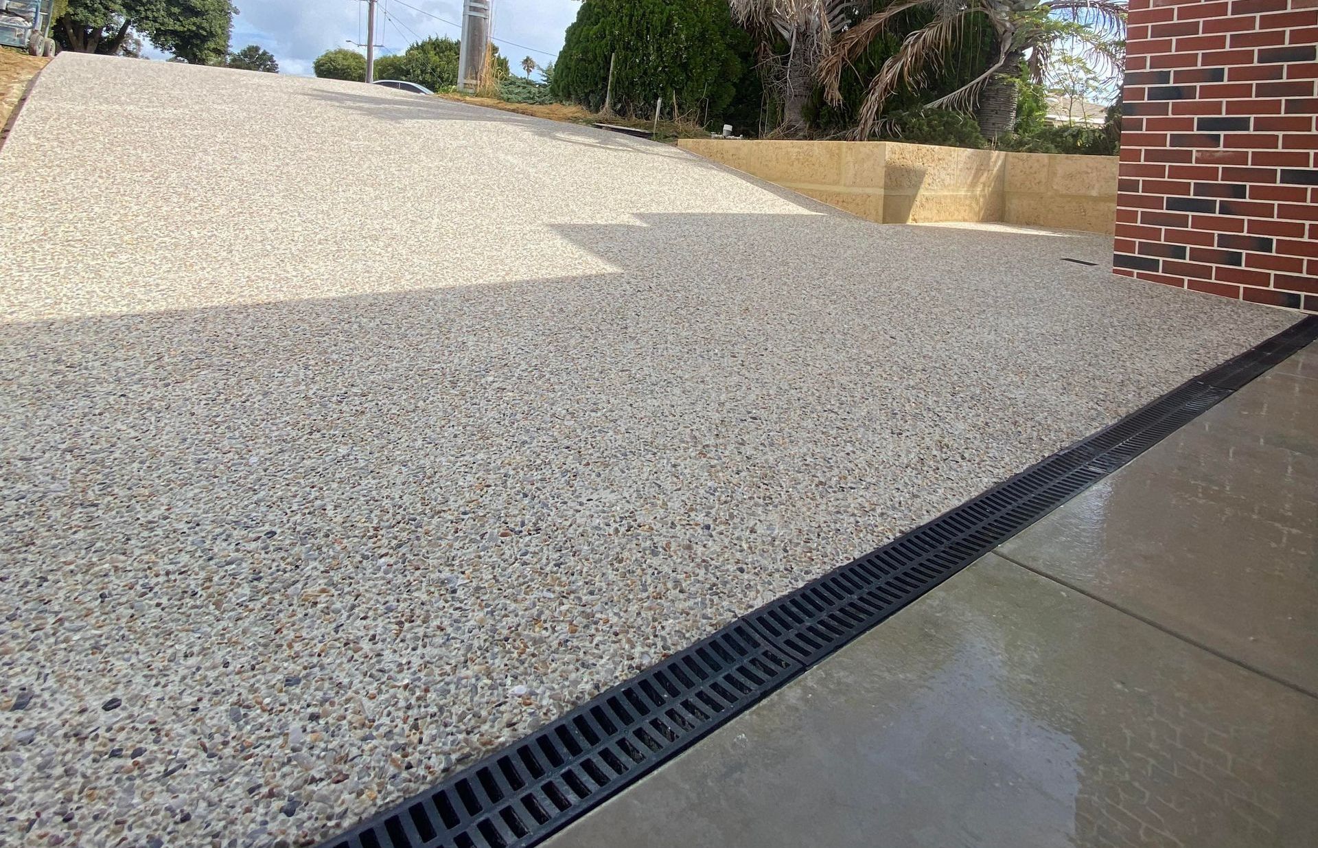 Exposed Aggregate Driveway with Drain for Water Run Off