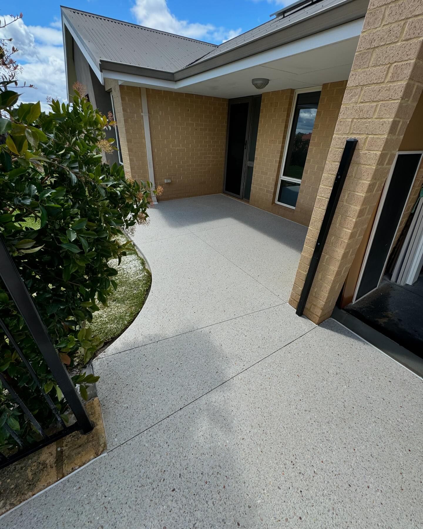 Coral White exposed aggregrate front pathway which replaced old damaged concrete pathway.