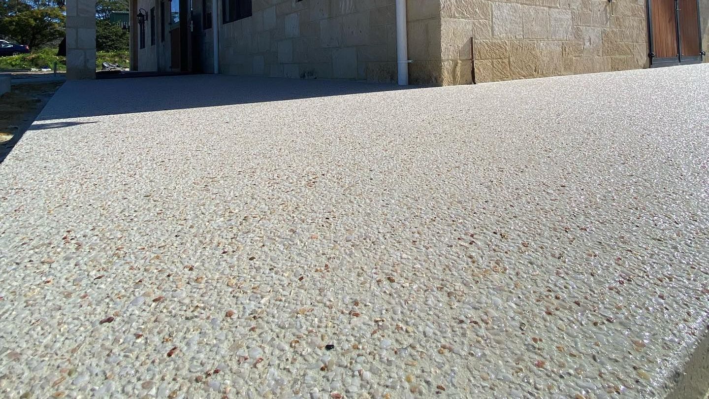 Exposed Aggregate Driveway Poured Around Stunning Horse Stable