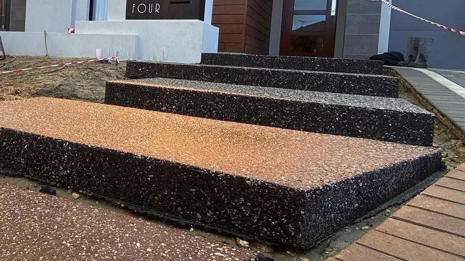 Exposed Aggregate Steps into Entrance of Home