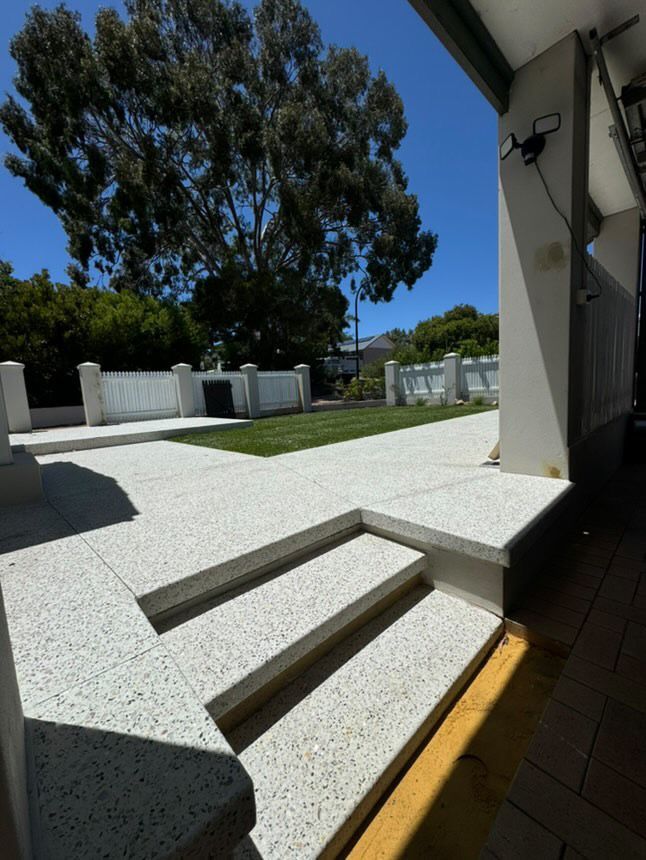Exposed agg concrete stairs with floating design