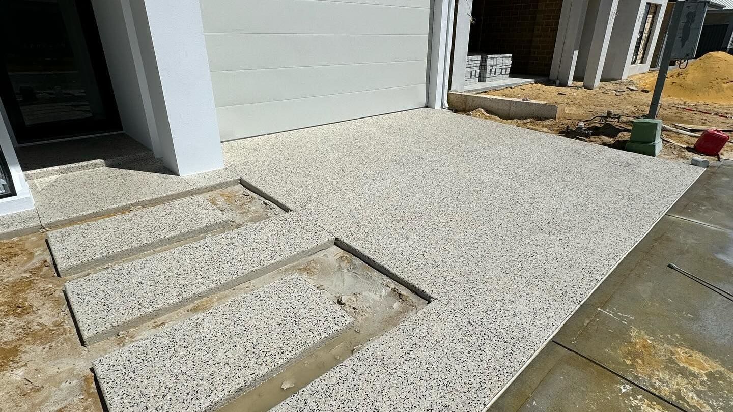 Exposed aggregate driveway with stepping stones