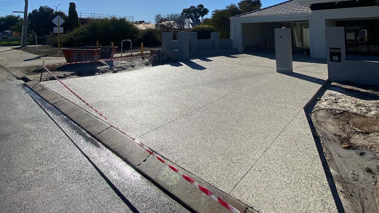 New home renovation with new exposed aggregate driveway by handmade concreting