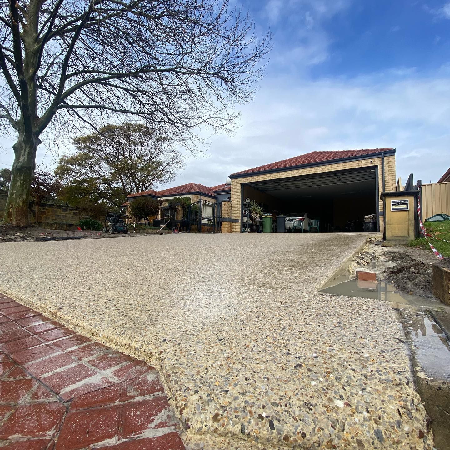 Geostone Holcim exposed aggregate driveway poured in Perth by Handmade Concreting