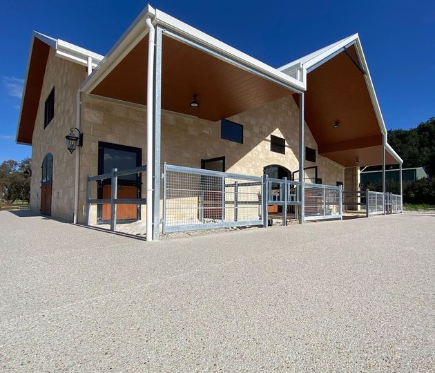 Exposed aggregate concrete poured around horse stable in Perth, WA