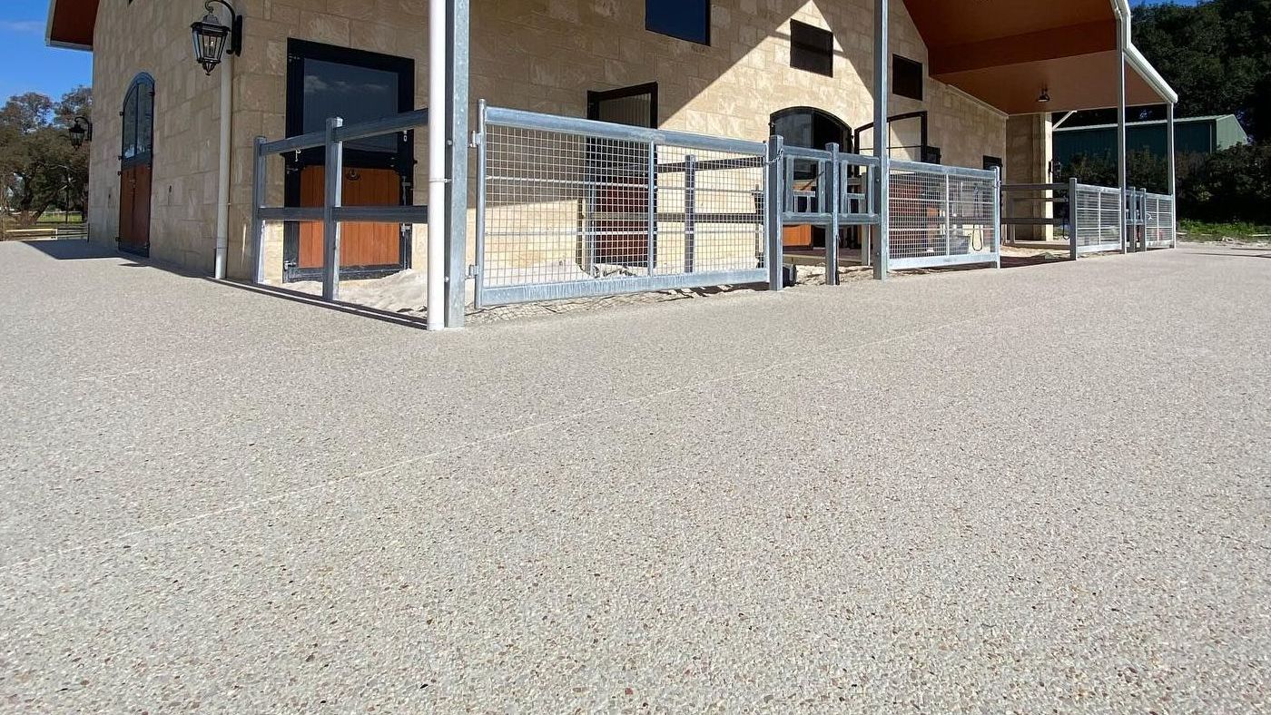 Horse Stables with exposed aggregate surrounding it