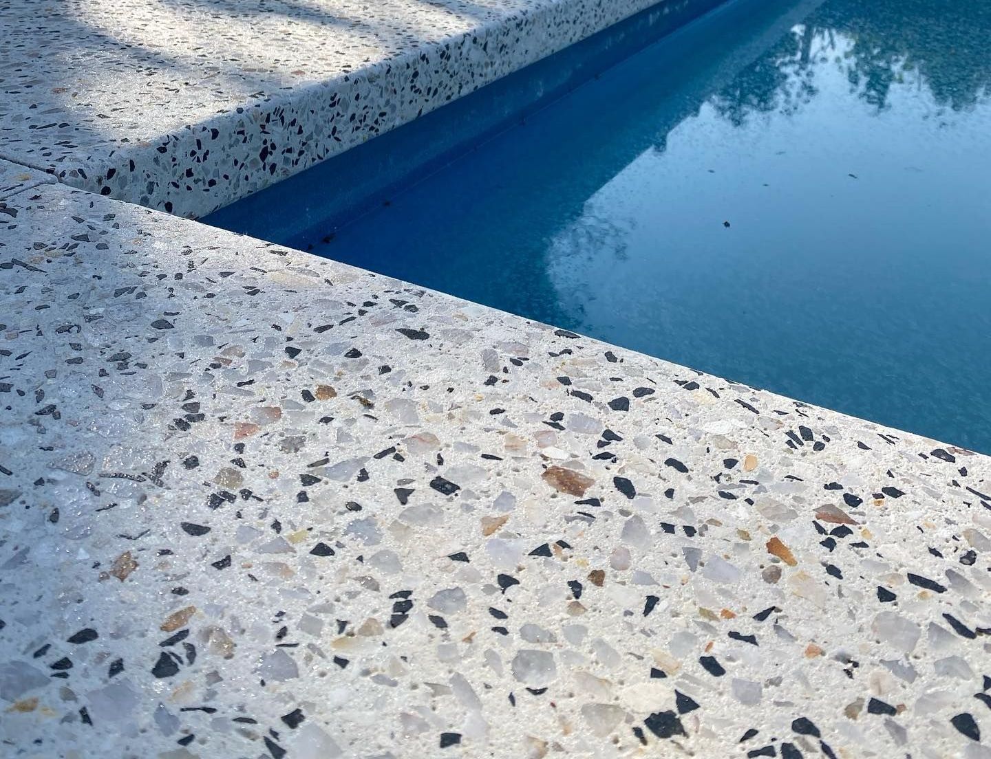 Honed Exposed Aggregate Concrete Pool Surrounds in Perth Backyard