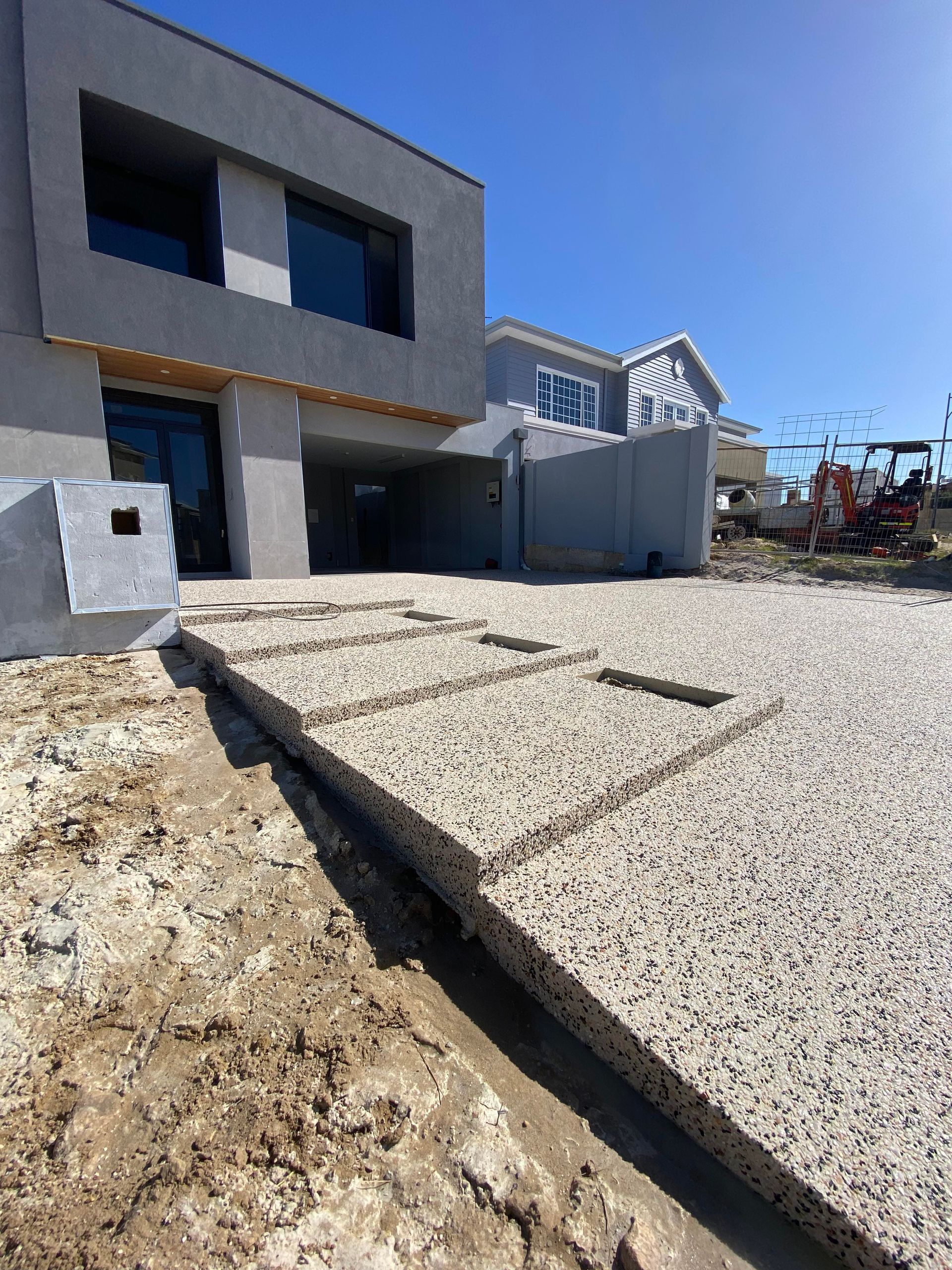 new exposed aggregate driveway and stairs