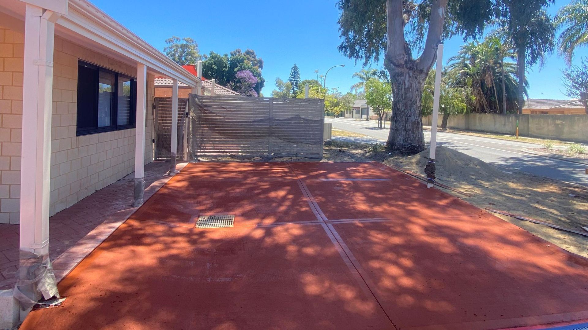 Coloured Concrete Parking Area with Storm Water Drain Installed