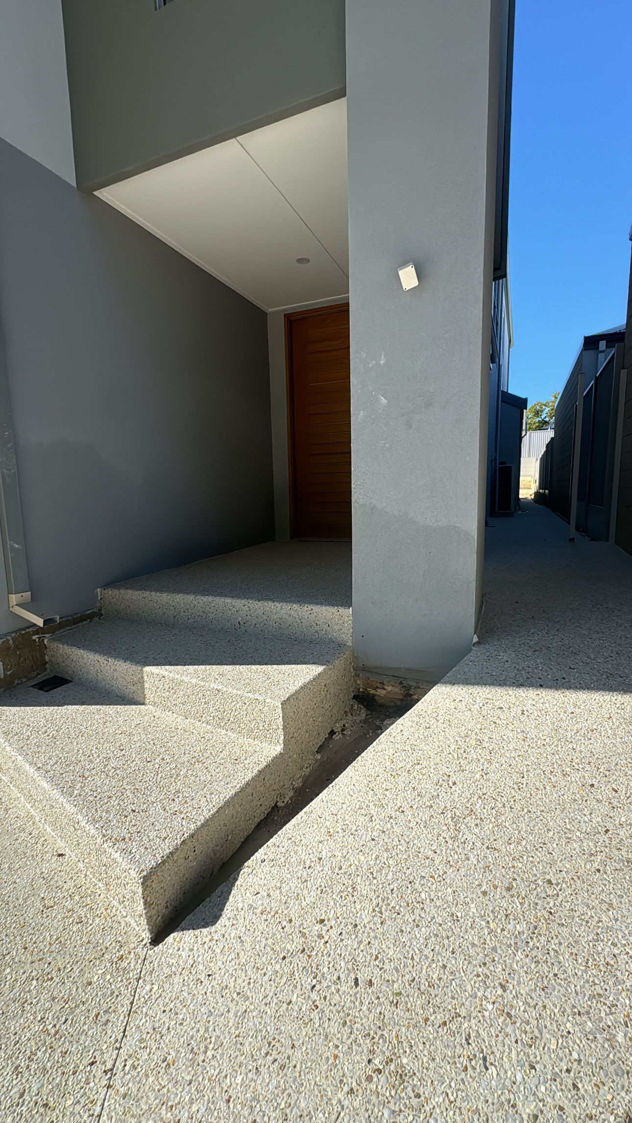 Concrete stairs and ramp poured in exposed aggregate coral mix for the side of a Perth home 