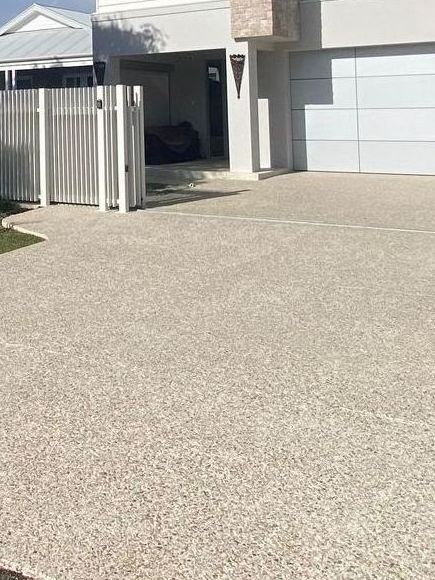 coral exposed aggregate concrete driveway