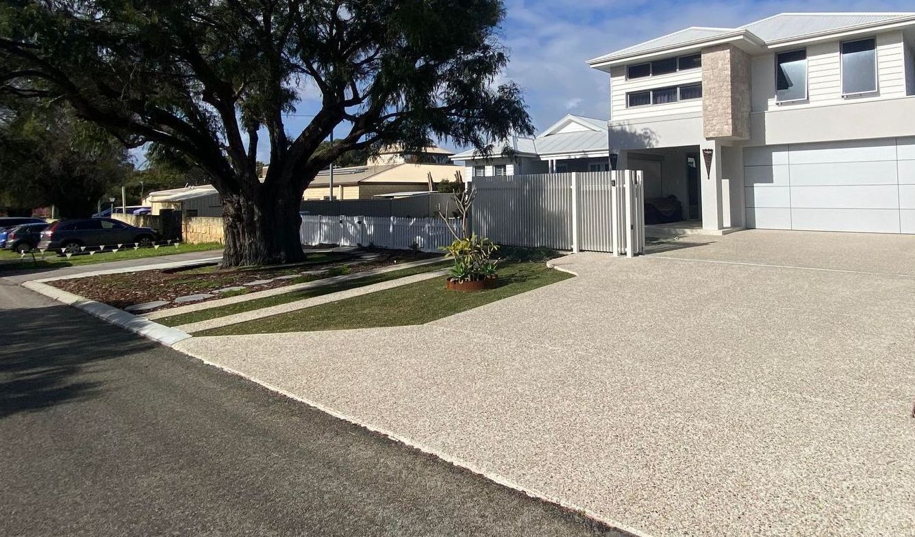 exposed aggregate driveway in front of two storey home in Perth