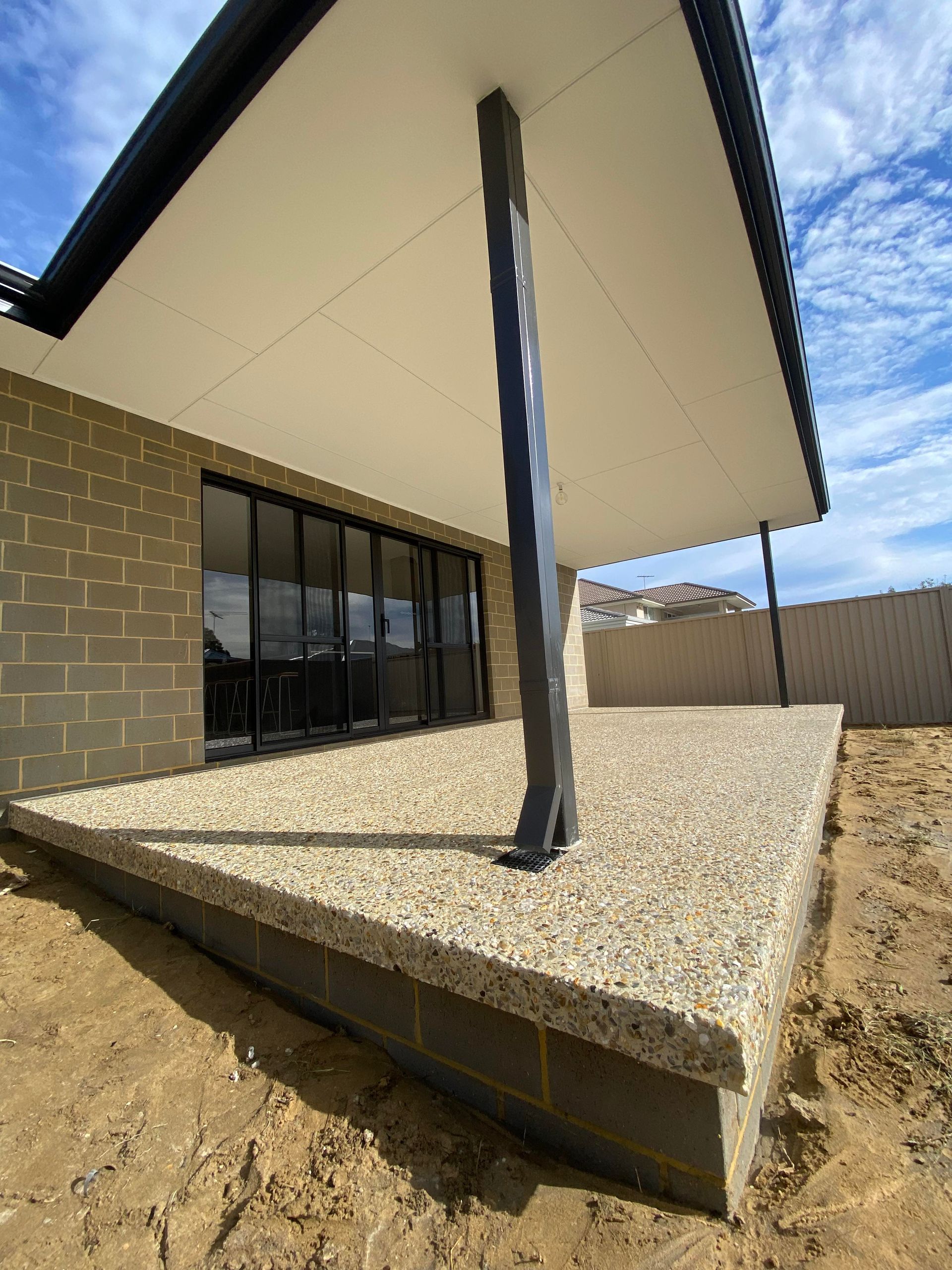 Decorative concrete hang for alfresco flooring in new Perth build.