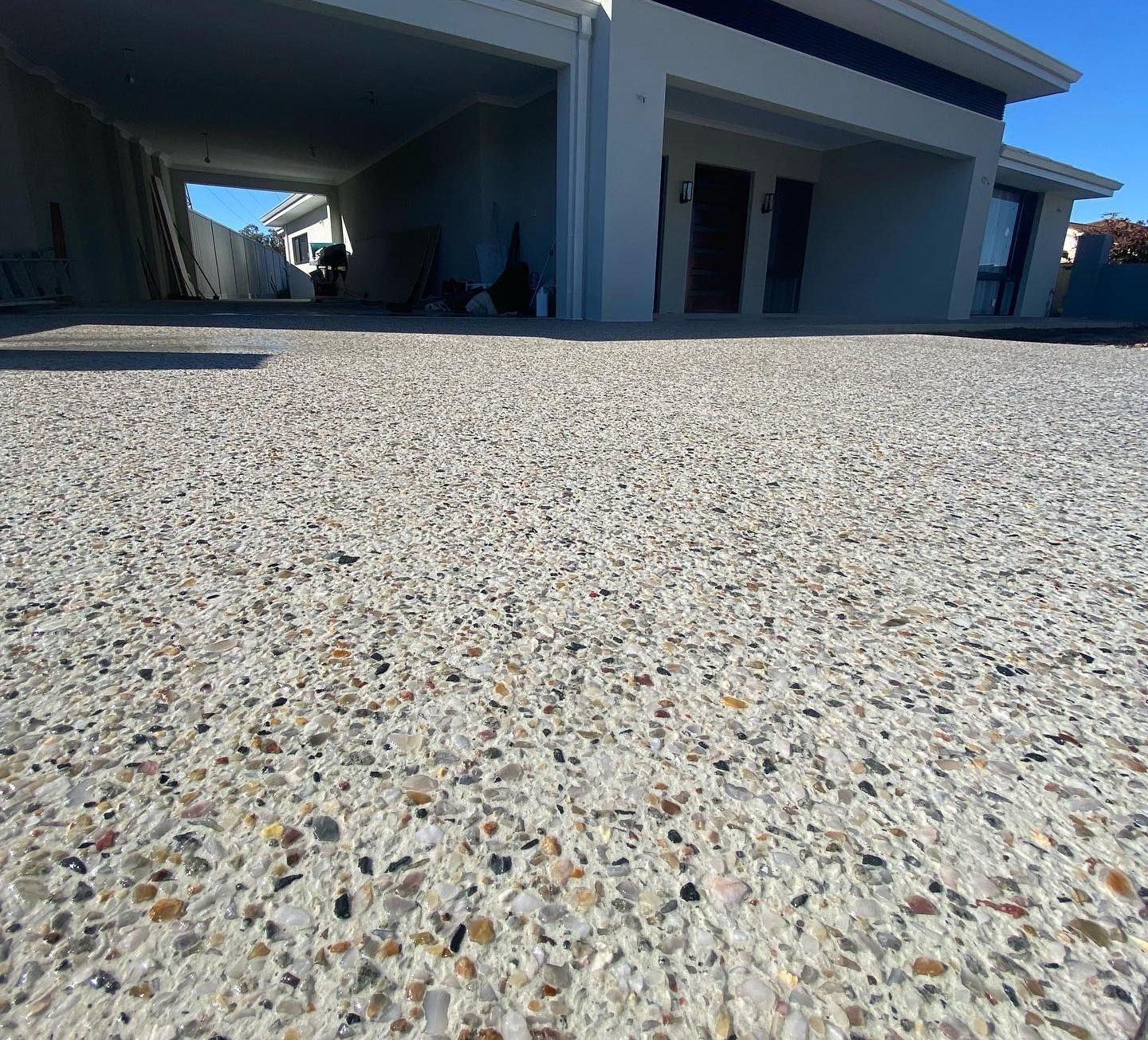 Stunning exposed aggregate concrete driveway by Handmade Concreting in Perth