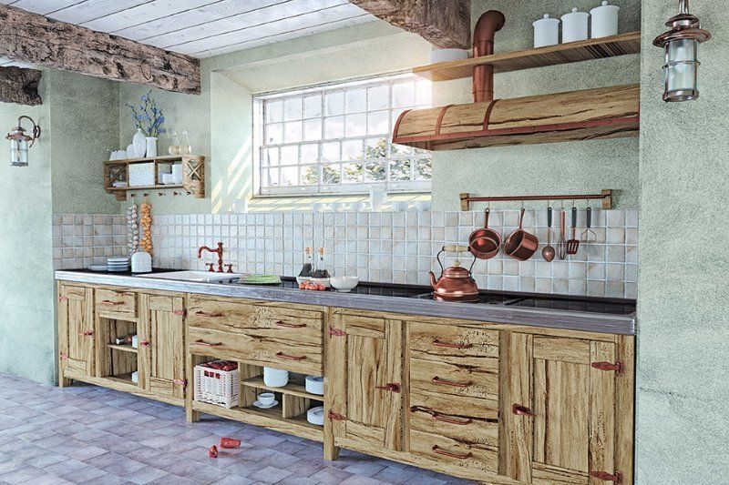 Rustic kitchen with wooden cabinets, copper cookware, and a window.