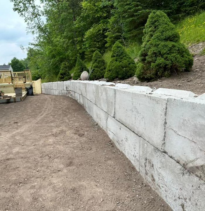 Installing a sturdy retaining wall as part of a hardscaping job in Rochester, NY