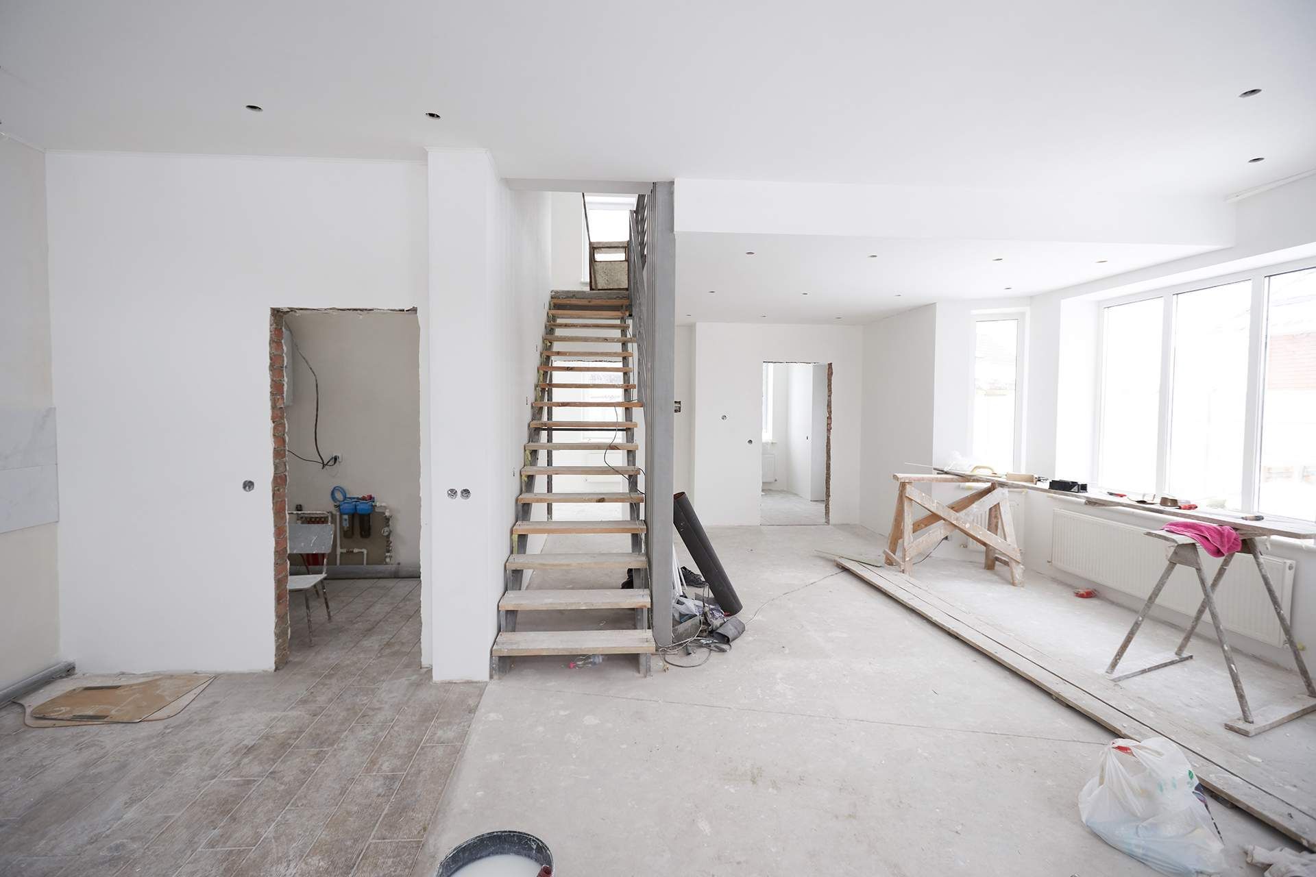 a staircase is being built in a room with white walls