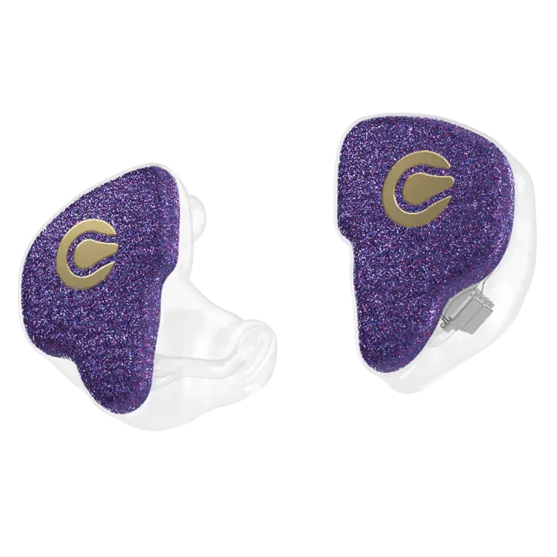 Two custom-molded in-ear monitors with sparkly purple faceplates featuring a gold logo and clear acrylic shells.
