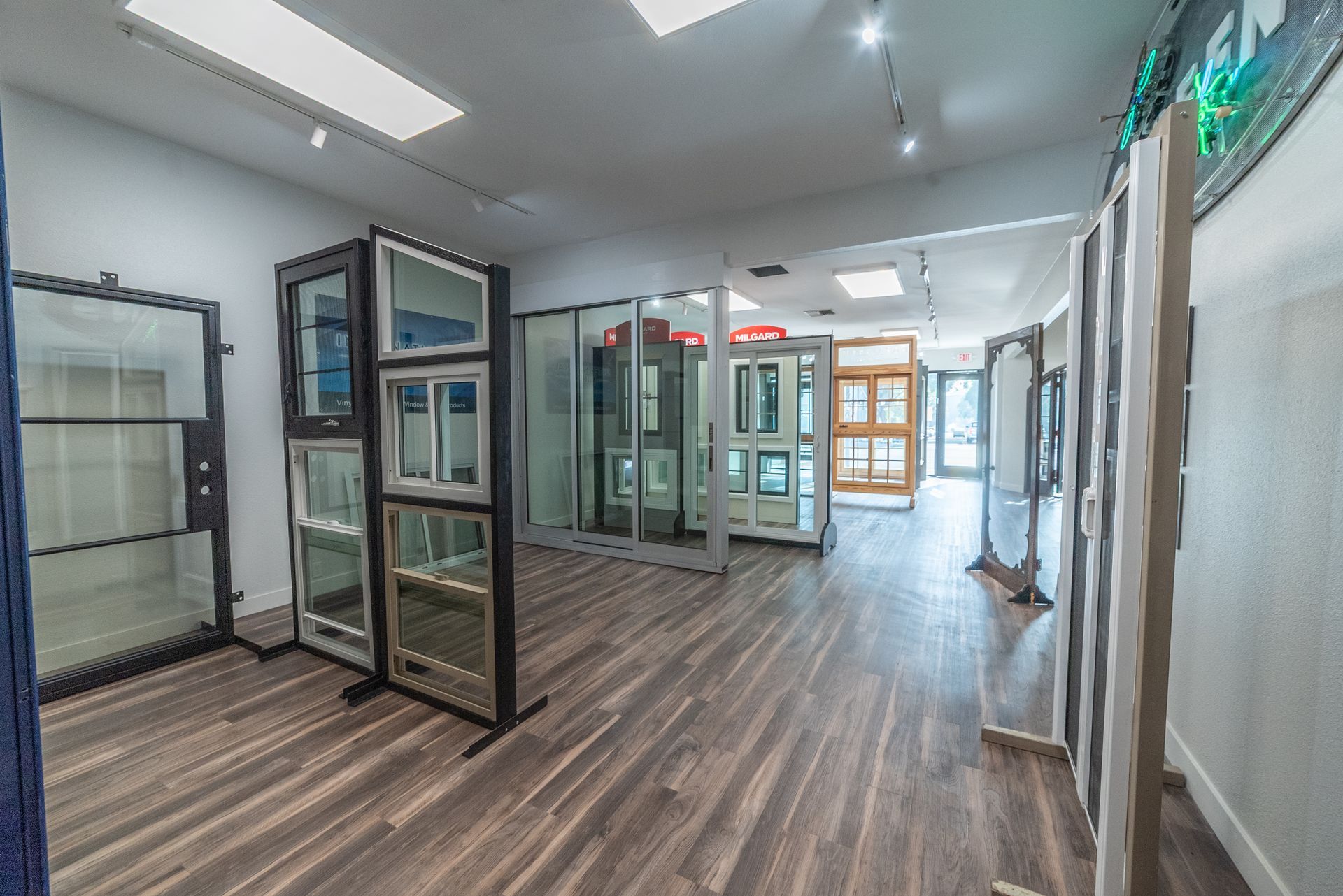 Business cards in a holder and pens in a cup on a counter at Tashman Home Center.