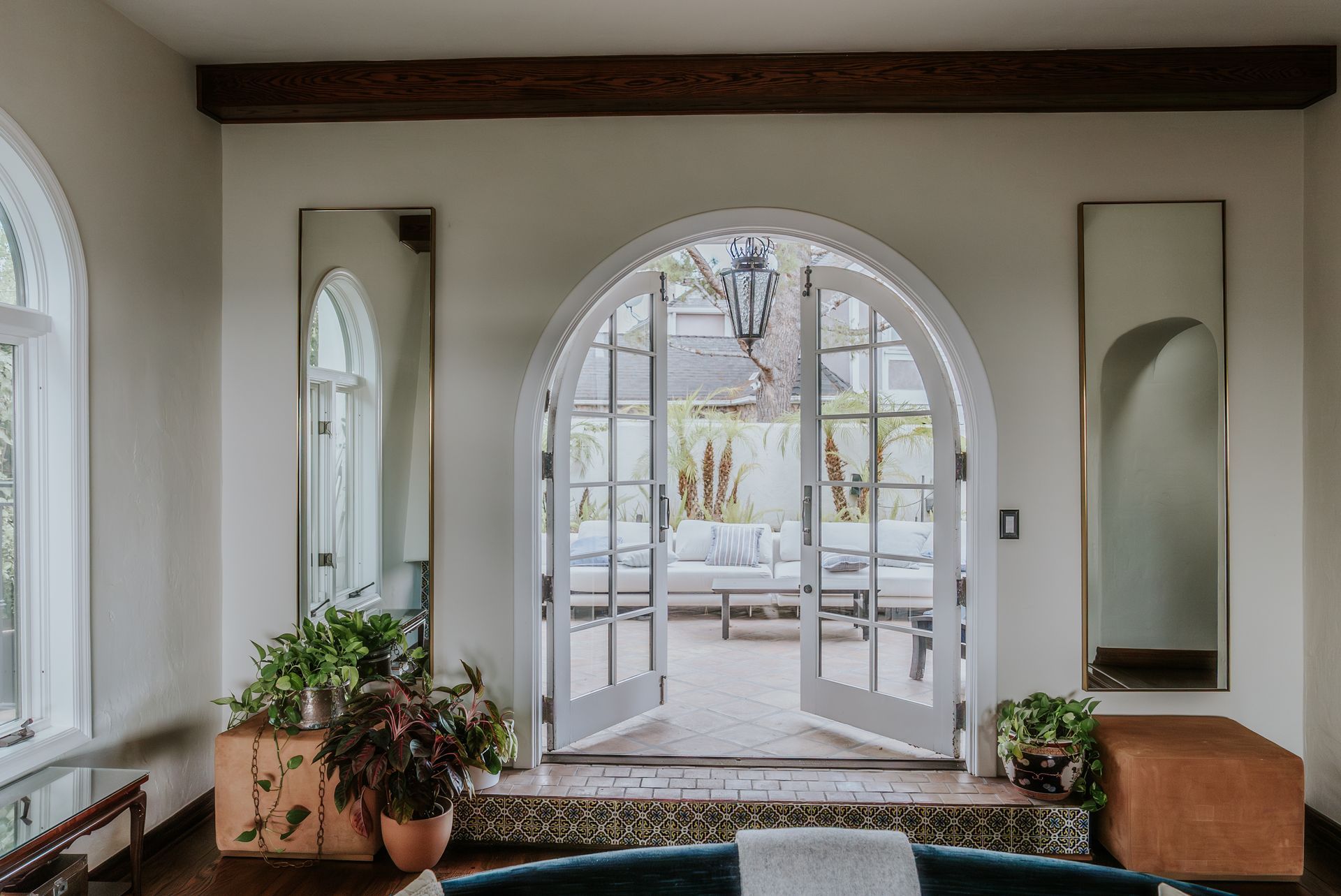 Wooden doors on display at a showroom, with informational tags attached.