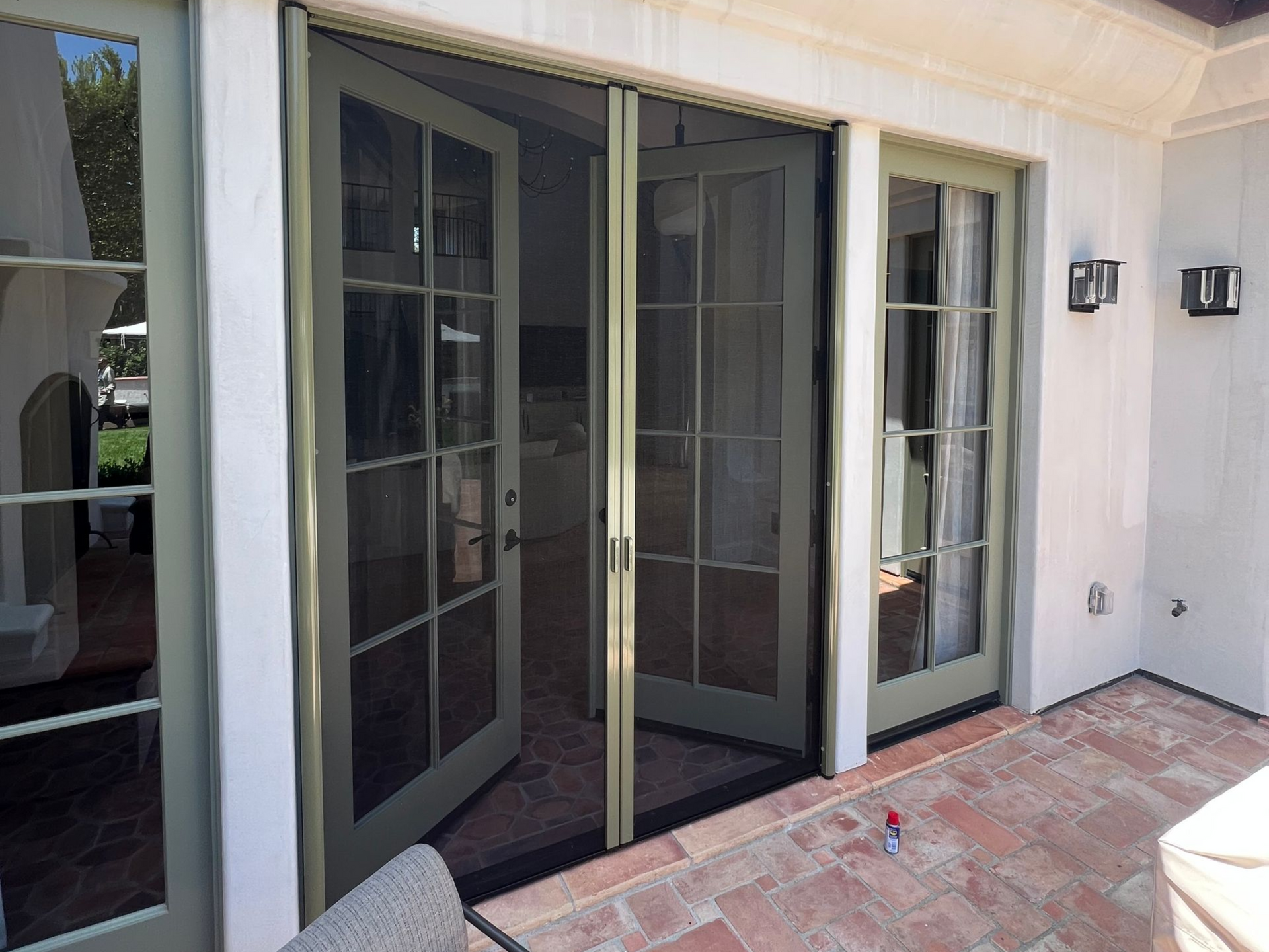 French doors open onto a patio, with a retractable screen.