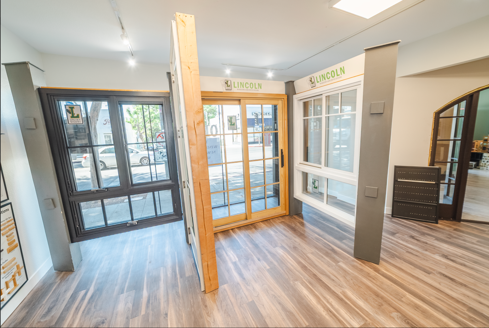 Showroom with various window and door displays, featuring different styles and colors.