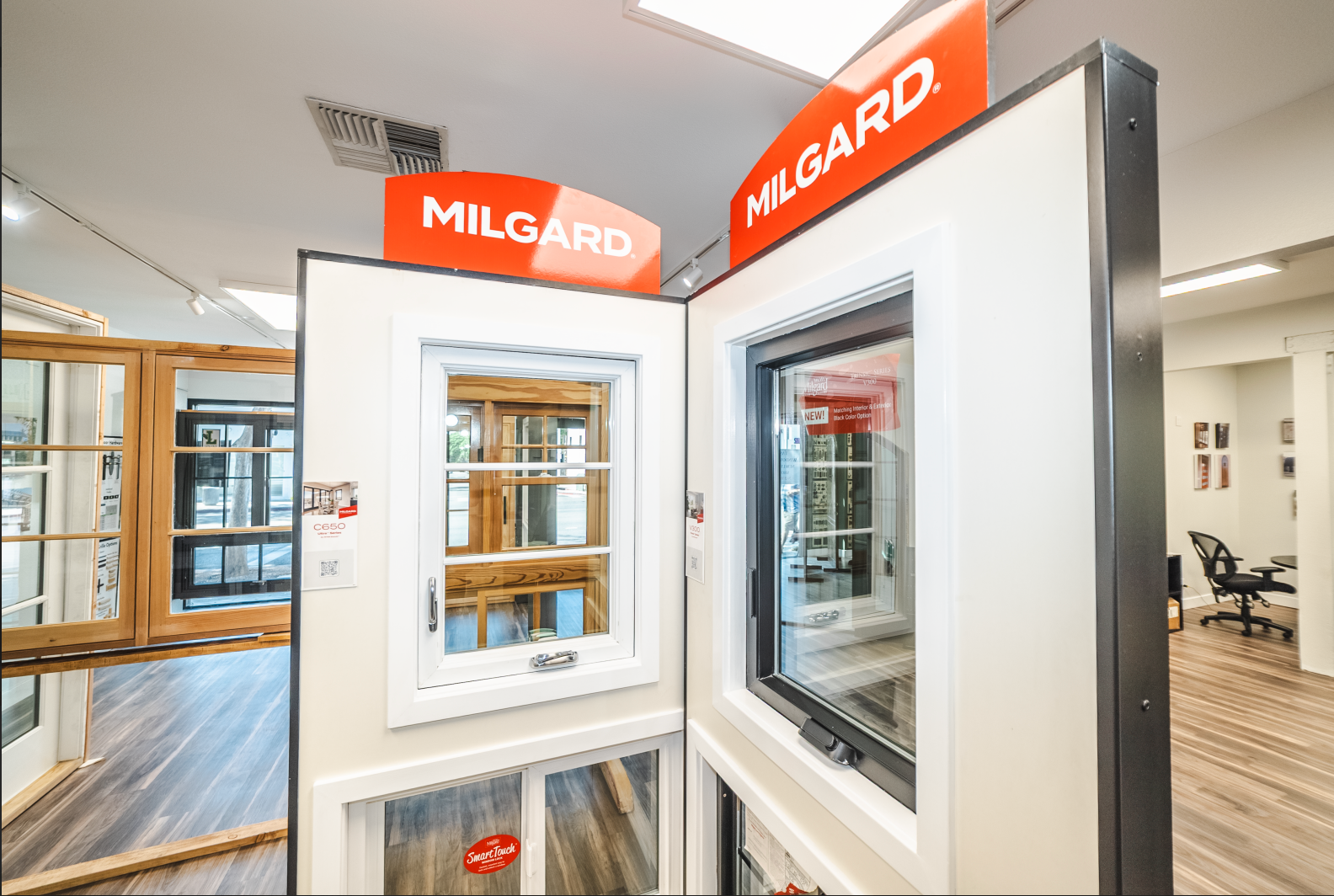 Milgard window displays in a showroom, showcasing different styles and features.
