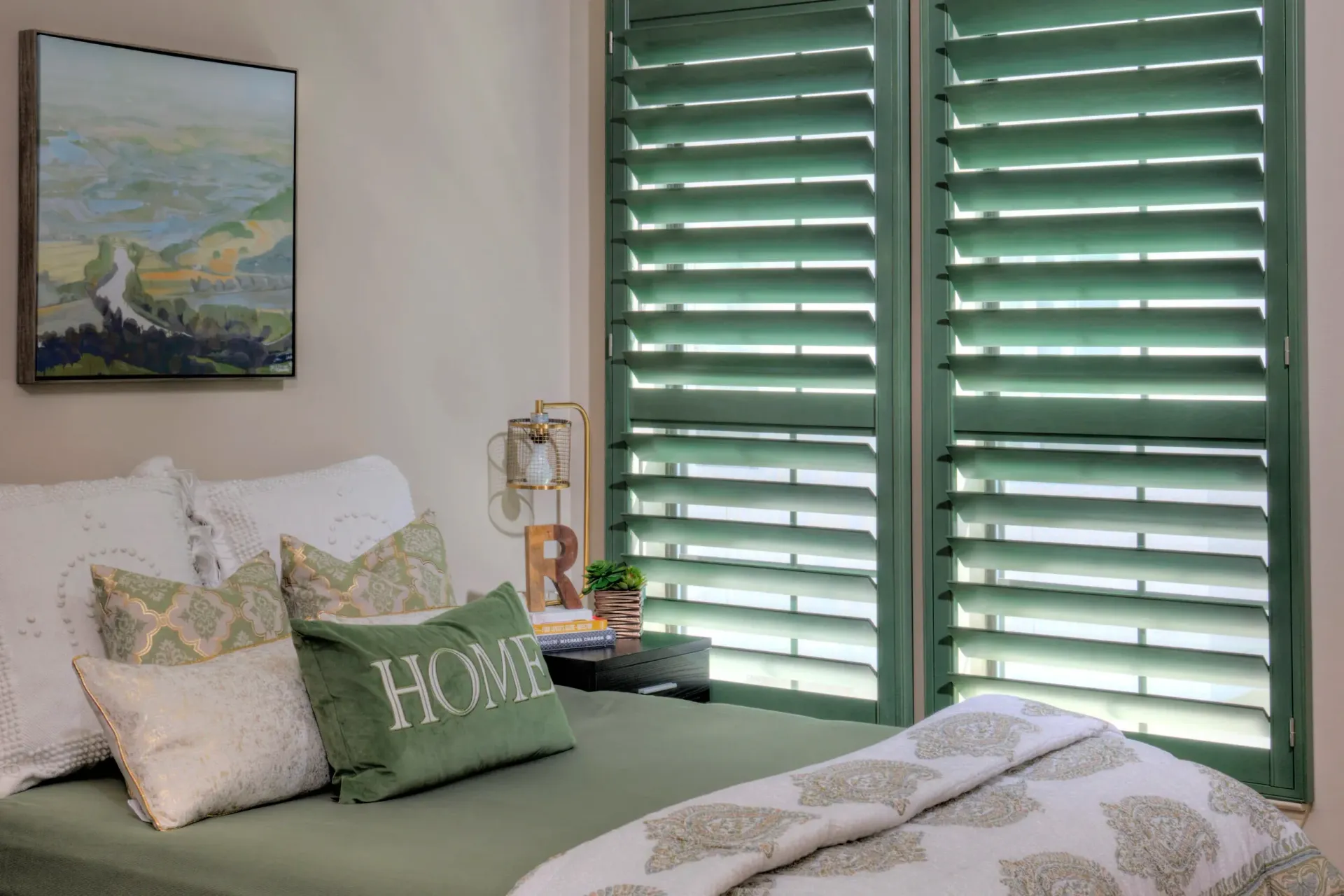 Luxurious villa with a pool, wooden deck, and lounge chairs. Palm trees and greenery surround the modern home.