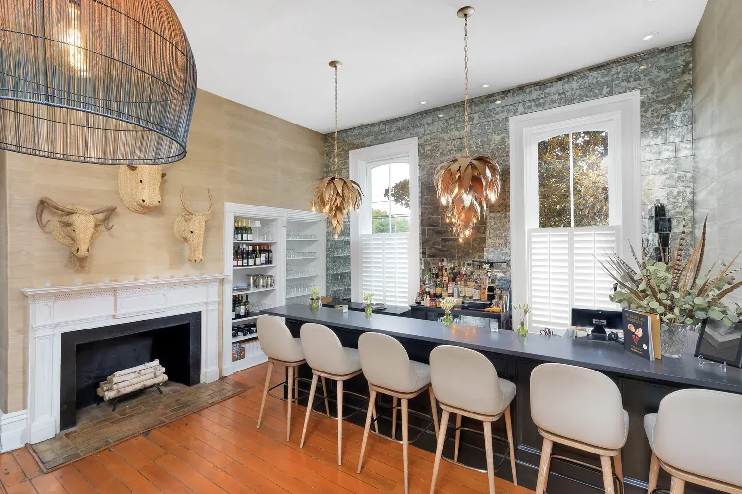 Patio with retractable black screens, seating areas, and a pool.