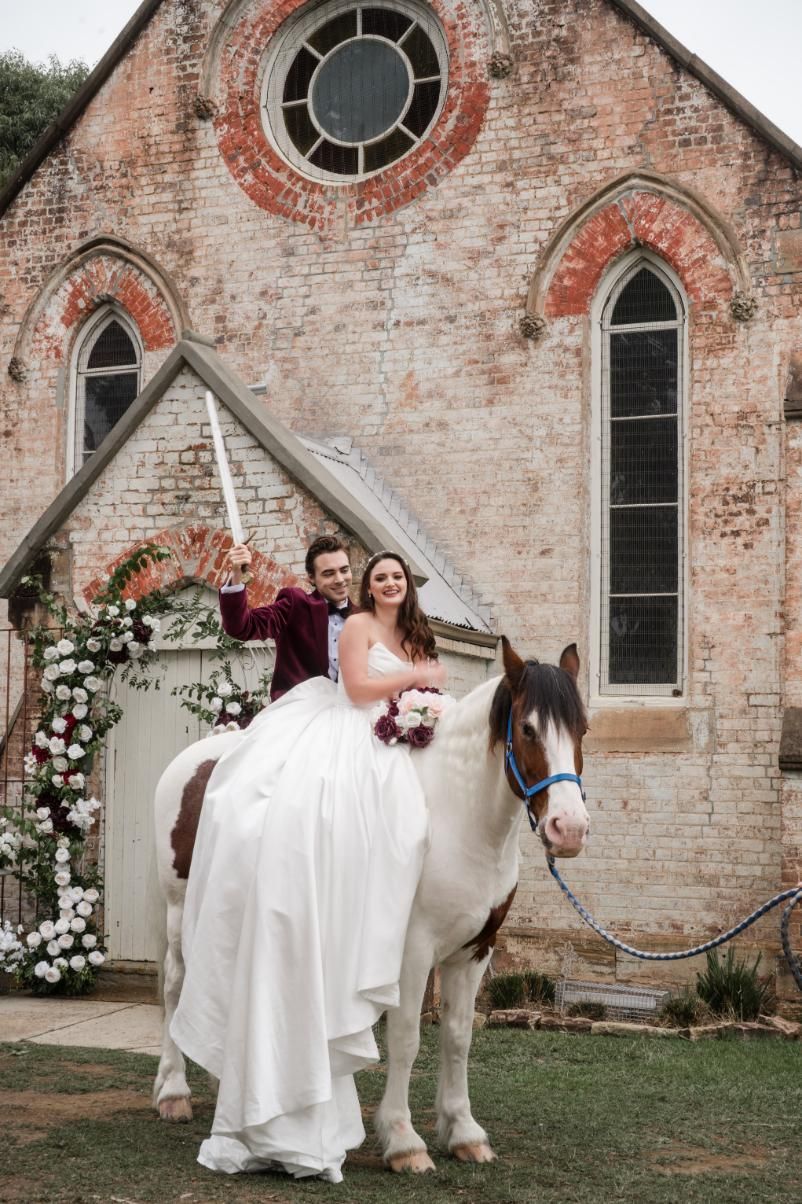 A Bride and Groom Are Riding on the Back of a Horse — Prestige Horse Carriages in Mitchells Flat, NSW