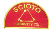 Red patch with "SCIOTO" above a triangle of arrows, and "SECURITY CO." below, all in gold.
