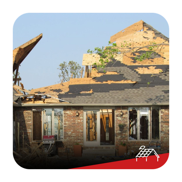 A brick house with a roof that has been damaged by a storm