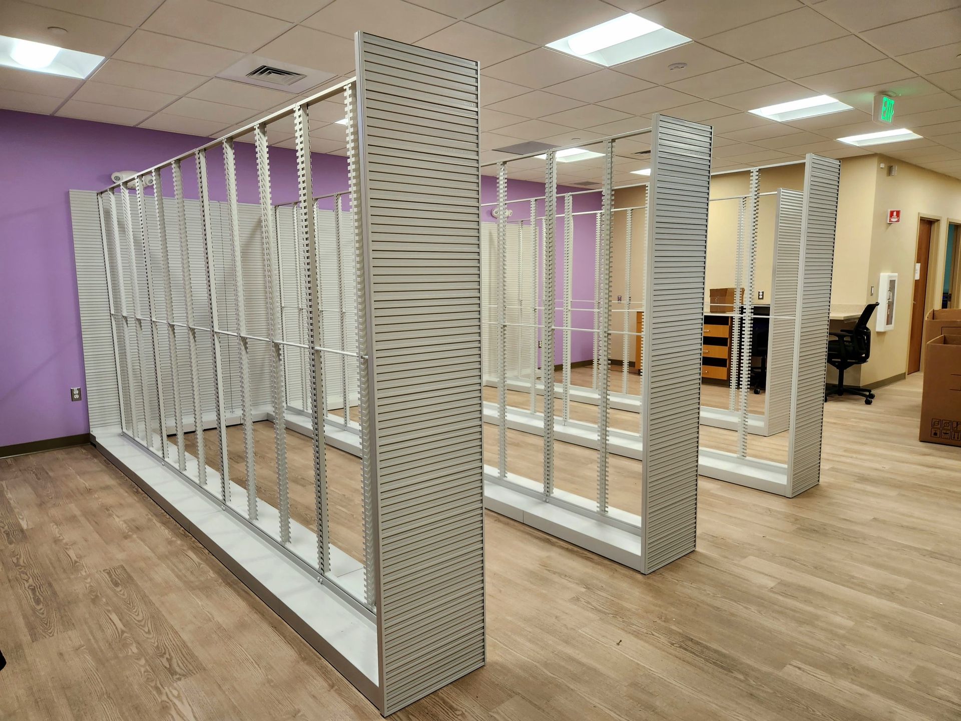 A row of shelves in a room with a purple wall — Aberdeen, MD — TLC Handyman Services LLC