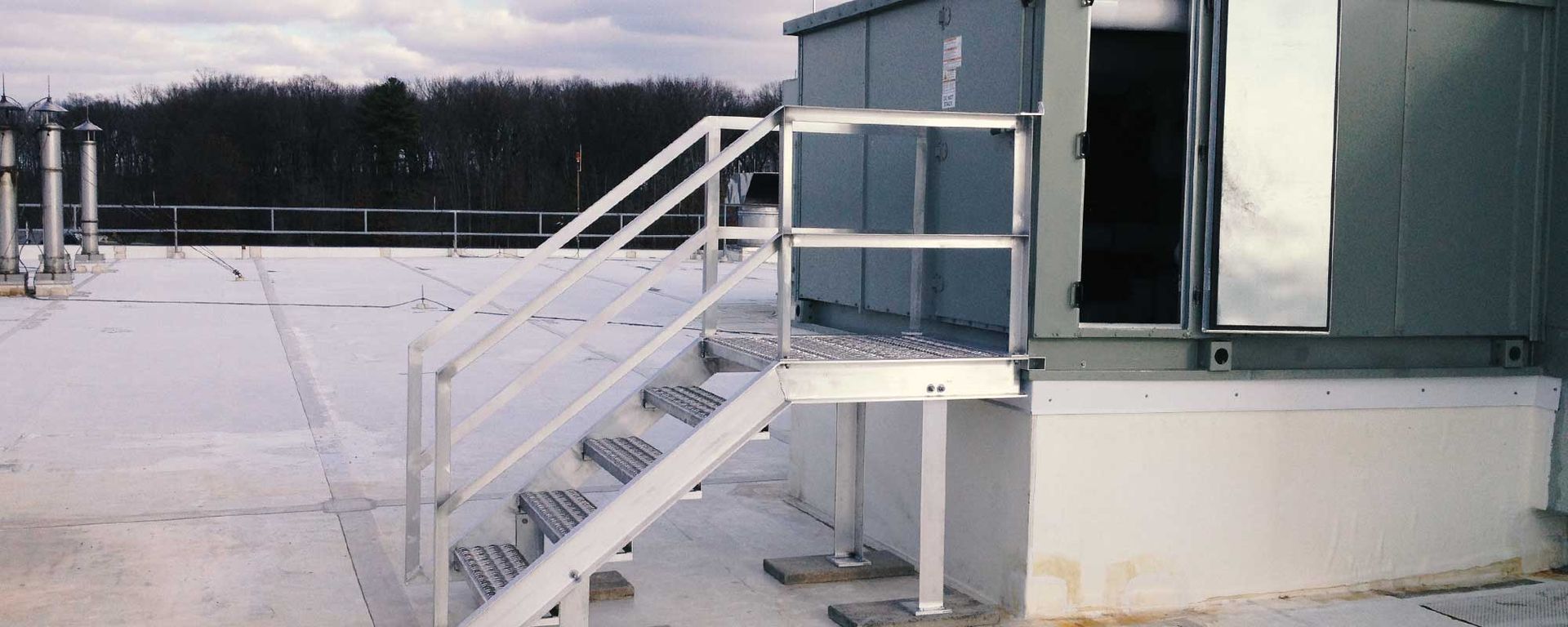 metal stairs leading to a storage container/room outdoor