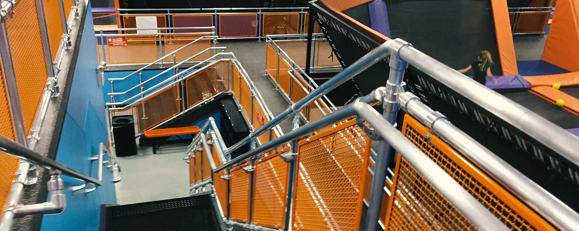 steel railings of stairs at an indoor sports/play facility