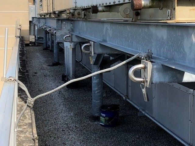 manufactured metal anchor points of a building/facility