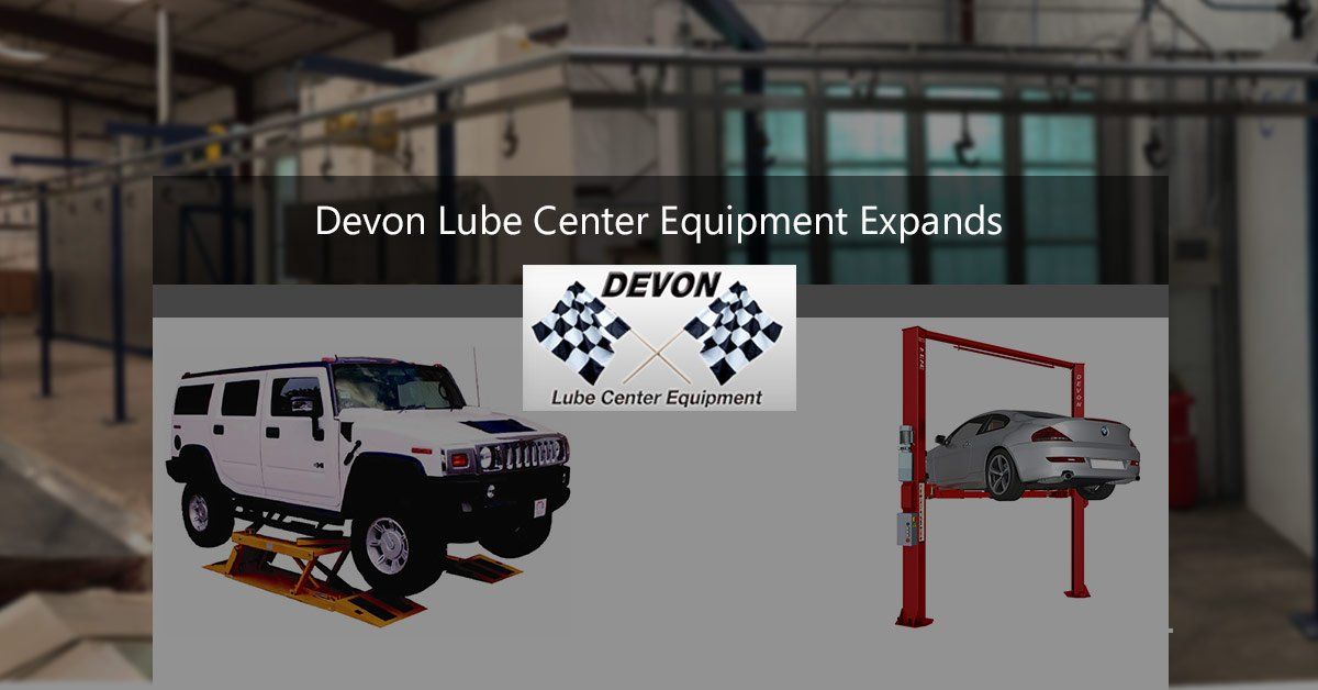 Devon Lube Center Lift Equipment with Cars on Lifts