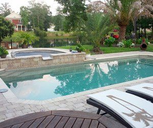 swimming pool and spa with water feature