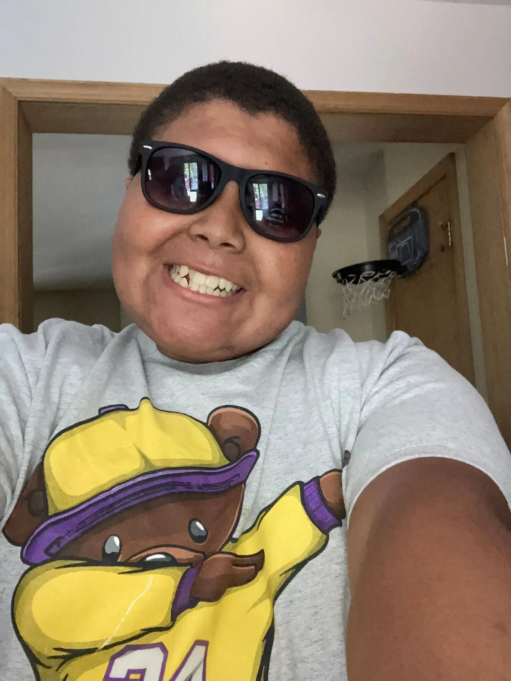 A Happy Boy is Wearing a Sunglass A Happy Boy is Wearing a Sunglass