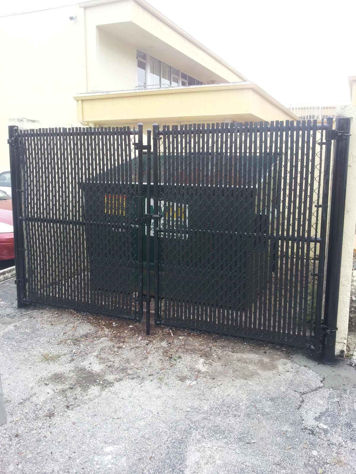 Dumpster Gates Black Vinyl — Sunrise, FL — First Class Fence & Rail, Inc.