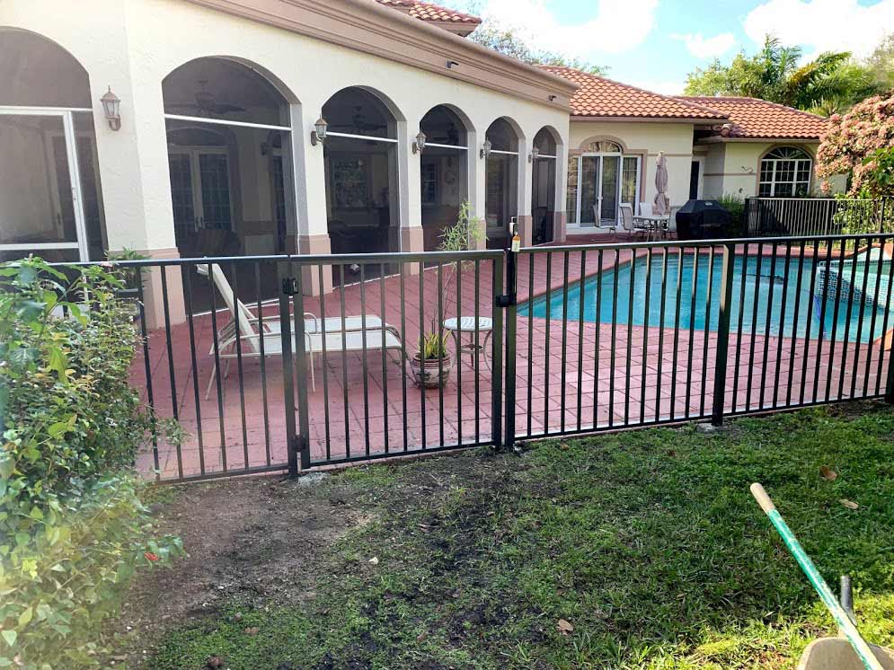 Bronze Handrail Pool Fence — Sunrise, FL — First Class Fence & Rail, Inc.