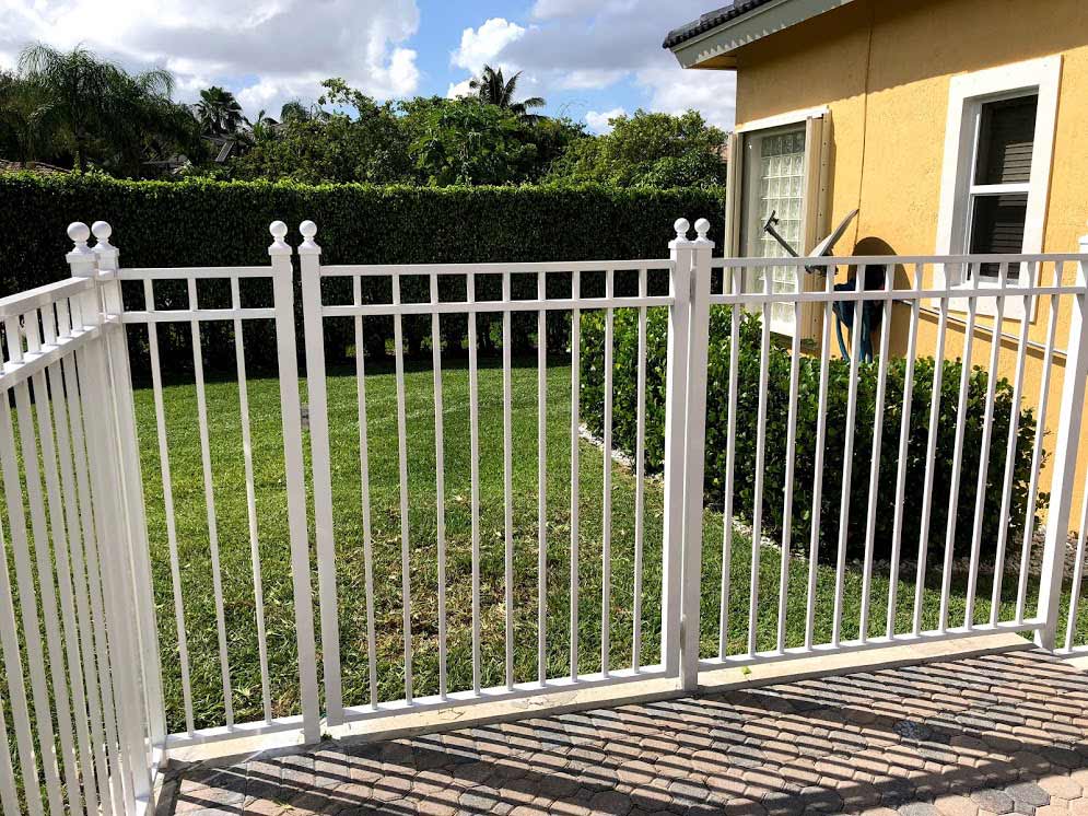 Mechanical Aluminum White Postrail — Sunrise, FL — First Class Fence & Rail, Inc.