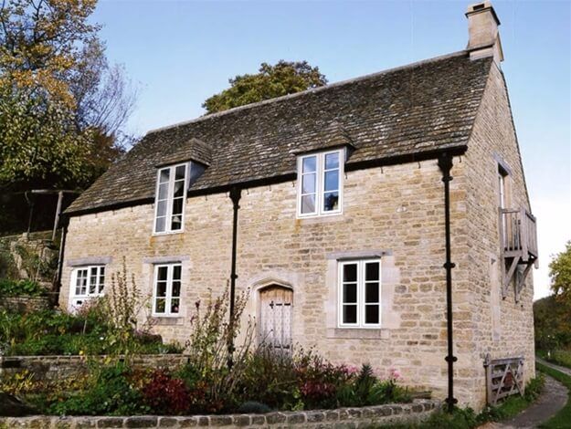 A large stone house with a slate roof