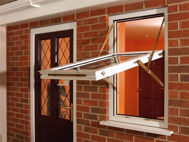 A brick building with a window that is open