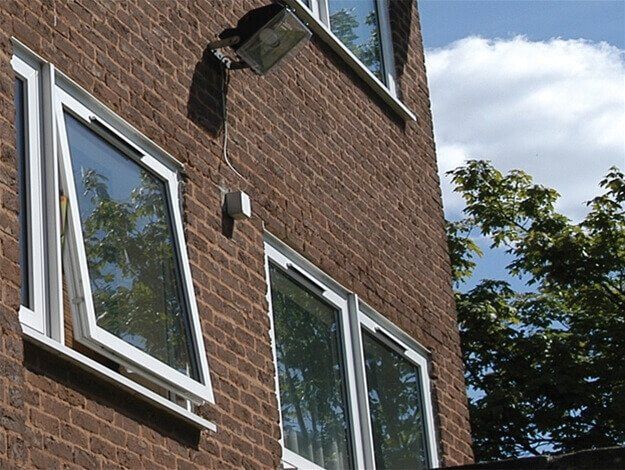 A brick building with a lot of windows on it